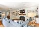 Comfortable living room features a fireplace, built-in bookshelves, and hardwood floors with plenty of seating at 2639 Acorn Ne Ave, Atlanta, GA 30305