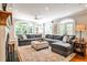 Cozy living room with fireplace, large sectional sofa, and an abundance of natural light from French doors at 2639 Acorn Ne Ave, Atlanta, GA 30305