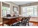 Home office with hardwood floors, a bay window and a classic executive desk with seating for clients at 2639 Acorn Ne Ave, Atlanta, GA 30305
