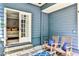 Cozy patio with rocking chairs and a glimpse into the bedroom through glass doors at 2639 Acorn Ne Ave, Atlanta, GA 30305