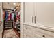 Spacious walk-in closet with custom shelves, cabinetry, and hardwood floors at 2639 Acorn Ne Ave, Atlanta, GA 30305
