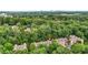 Stunning aerial view of townhomes surrounded by lush trees near a vibrant cityscape at 5439 Alanis Se Pl # 17, Mableton, GA 30126