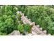 Aerial view of well-maintained townhomes with brick facades and lush greenery surrounding the community at 5439 Alanis Se Pl # 17, Mableton, GA 30126