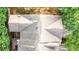 Birds eye view of townhome rooftops, patios, and mature trees in an urban setting at 5439 Alanis Se Pl # 17, Mableton, GA 30126
