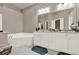 Primary bathroom featuring a soaking tub and double vanity at 5439 Alanis Se Pl # 17, Mableton, GA 30126