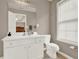 Bathroom with a single sink vanity and window for natural light at 5439 Alanis Se Pl # 17, Mableton, GA 30126