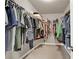 Walk-in closet with rods and shelves for organized clothing storage at 5439 Alanis Se Pl # 17, Mableton, GA 30126