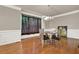 Bright dining room featuring hardwood floors, crown molding, and a modern light fixture at 5439 Alanis Se Pl # 17, Mableton, GA 30126