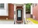 Close-up of a home's entryway, featuring a dark door and traditional brick facade at 5439 Alanis Se Pl # 17, Mableton, GA 30126