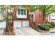 Attractive brick townhome with a two-car garage, and inviting entrance framed by mature trees at 5439 Alanis Se Pl # 17, Mableton, GA 30126