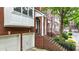 Lovely brick townhome showing the garage, entrance and landscaping at 5439 Alanis Se Pl # 17, Mableton, GA 30126