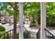 Charming townhome exterior featuring a two-car garage and lush greenery, creating an inviting curb appeal at 5439 Alanis Se Pl # 17, Mableton, GA 30126