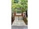 Charming brick townhome featuring a two-car garage and inviting front entrance with landscaped surroundings at 5439 Alanis Se Pl # 17, Mableton, GA 30126