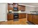 Well-equipped kitchen features wood cabinets, granite counters, and stainless steel oven at 5439 Alanis Se Pl # 17, Mableton, GA 30126