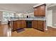 This kitchen showcases wood cabinets, sleek black appliances, and granite countertops at 5439 Alanis Se Pl # 17, Mableton, GA 30126