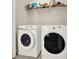 A laundry room with a modern, front-loading washer and dryer at 5439 Alanis Se Pl # 17, Mableton, GA 30126