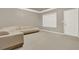 Bright living room with neutral carpet, paint, and large window at 5439 Alanis Se Pl # 17, Mableton, GA 30126