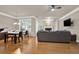 Open floor plan with a dining area, living room featuring a fireplace and a large window at 5439 Alanis Se Pl # 17, Mableton, GA 30126