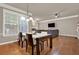 Open floor plan with dining area connected to the living room with a fireplace at 5439 Alanis Se Pl # 17, Mableton, GA 30126