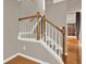 A wooden staircase featuring painted risers, perfect for any modern home at 5439 Alanis Se Pl # 17, Mableton, GA 30126