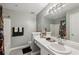 Stylish bathroom featuring modern vanity and a glass-enclosed shower with updated fixtures at 7077 Biltmore Trce, Lithonia, GA 30058