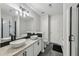 Elegant bathroom featuring double vanity sinks, a modern shower, and sleek finishes at 7077 Biltmore Trce, Lithonia, GA 30058