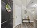 Welcoming entryway with hardwood floors, a staircase, and stylish decor at 7077 Biltmore Trce, Lithonia, GA 30058
