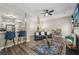 Open-concept living area with a breakfast bar, modern decor, and sleek finishes at 7077 Biltmore Trce, Lithonia, GA 30058