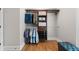 Custom closet with wood shelves and hanging rods, perfect for organization and storage at 7251 Bluewater Ln, Douglasville, GA 30135