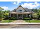Community clubhouse with great architecture, attractive landscaping, and accessible parking spots at 7251 Bluewater Ln, Douglasville, GA 30135