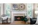 Close-up of the fireplace, showcasing the mantel decor with a 'Home Sweet Home' sign and decorative accents at 7251 Bluewater Ln, Douglasville, GA 30135
