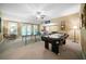 Spacious game room featuring ping pong, and an air hockey table for leisure at 7251 Bluewater Ln, Douglasville, GA 30135