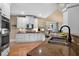 Well-lit kitchen with stainless steel appliances, granite countertops, and a view of the living area at 7251 Bluewater Ln, Douglasville, GA 30135
