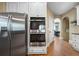 Bright kitchen with stainless steel appliances including double ovens and a large refrigerator at 7251 Bluewater Ln, Douglasville, GA 30135