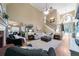 Open living room with fireplace, staircase, and view into kitchen and dining area at 7251 Bluewater Ln, Douglasville, GA 30135