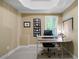 Home office with a neutral palette, carpet, desk, and window with natural light at 7251 Bluewater Ln, Douglasville, GA 30135