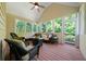 Sunroom with wicker furniture and bright lighting, perfect for relaxing at 7251 Bluewater Ln, Douglasville, GA 30135