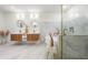 Elegant bathroom features a double vanity, soaking tub, and walk-in shower with gold fixtures at 2155 Venetian Sw Dr, Atlanta, GA 30311