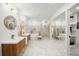 Luxurious bathroom with double vanity, soaking tub, separate shower, and marble flooring at 2155 Venetian Sw Dr, Atlanta, GA 30311
