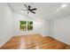 Bright bedroom with hardwood floors, ceiling fan and double windows with tree view at 2155 Venetian Sw Dr, Atlanta, GA 30311