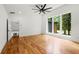 An empty room with wooden floor and a ceiling fan at 2155 Venetian Sw Dr, Atlanta, GA 30311