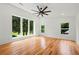 Empty room with hardwood floors, a ceiling fan, and plenty of natural light at 2155 Venetian Sw Dr, Atlanta, GA 30311