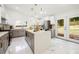 Modern kitchen with granite countertops, stainless steel appliances, an island, and access to the backyard at 2155 Venetian Sw Dr, Atlanta, GA 30311