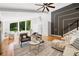 Bright and airy living room with high ceilings, hardwood floors, large windows, and modern decor at 2155 Venetian Sw Dr, Atlanta, GA 30311