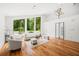Bright living room with vaulted ceiling, hardwood floors, and large windows with a view of the outdoors at 2155 Venetian Sw Dr, Atlanta, GA 30311