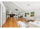 Open-concept living area with hardwood floors, high ceilings, stairs and natural light from windows at 2155 Venetian Sw Dr, Atlanta, GA 30311