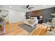 The main bedroom offers hardwood floors, a ceiling fan, and a cozy seating area at 2155 Venetian Sw Dr, Atlanta, GA 30311