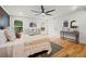 Bright main bedroom features hardwood floors, a ceiling fan, and natural lighting at 2155 Venetian Sw Dr, Atlanta, GA 30311