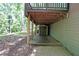 Patio area and backyard storage beneath the deck offering additional outdoor living space at 295 Lakemont Dr, Roswell, GA 30075