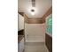 Bathroom with a tub and shower combination, complete with white cabinets and a window at 295 Lakemont Dr, Roswell, GA 30075